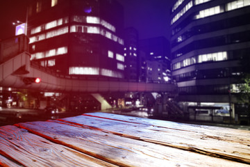 Obraz premium wooden desk and city landscape 
