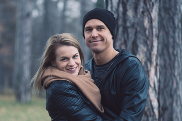 Happy loving couple in park. Outdoor portrait of young couple.