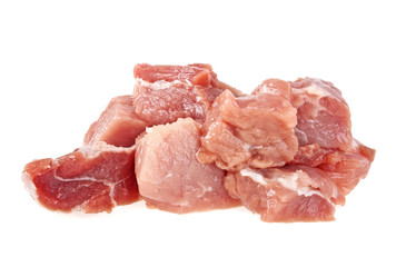 Heap of raw meat cuts isolated on white background