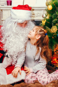 Santa Claus and little girl.