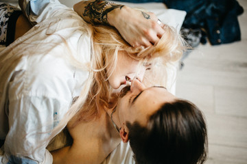 Fototapeta na wymiar Close up portrait of a young couple kissing.