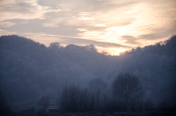 Frozen landscape under sunset