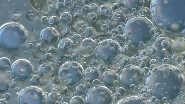 Blue bubbles in water. Extreme macro footage.