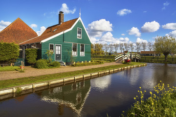 Fototapeta na wymiar Typical Dutch village Zaanstad in spring sunny day. Netherlands,