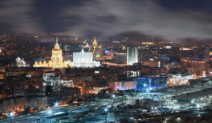 Fototapeta premium View from the roof tops in the winter on night city Moscow.