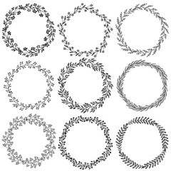 Fototapeta premium Set of hand drawn vector floral wreaths with leaves, flowers, berries.