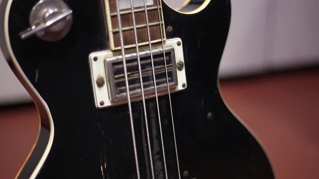 black electric bass guitar, rock musician instrument