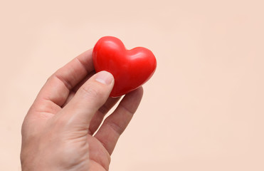Red healthy heart in hand