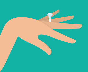 Diamond engagement ring on a womans finger