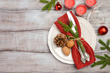 Christmas table place setting with xmas decorations, top view, horizontal, copy space.
