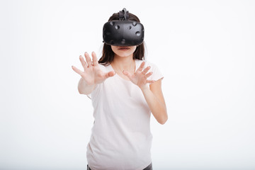 Young lady wearing virtual reality device