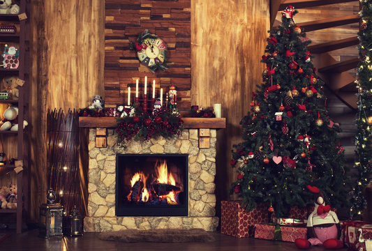 Beautiful Holiday Decorated Room With Christmas Tree, Fireplace At Night. Led Lighting, Cozy Home Scene. Nobody There.