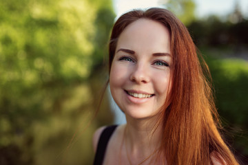 Fototapeta premium portrait of happy red hair girl