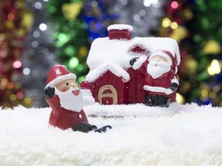 Santa   sitting in front of   Christmas tree waiting for Christmas
