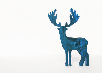 Blue wooden reindeer on white background