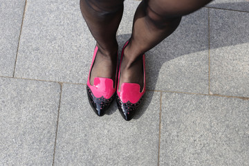Fototapeta na wymiar Feet girl and stylish shoes