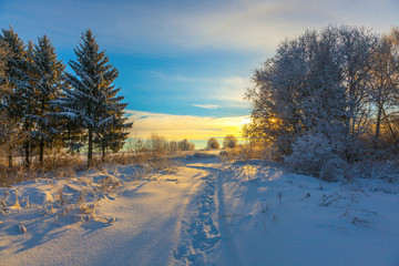 Winter snow landscape with sky and Sun