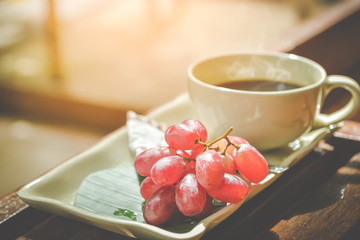 grape and cup of coffee in morning