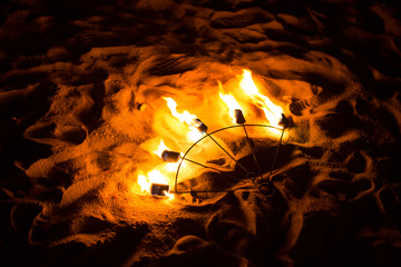 Fire Show Fire Movement. Fan of fire on the sand.