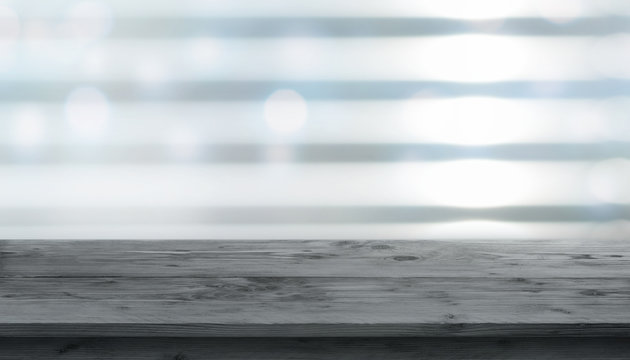 Dark wooden table in front of a window