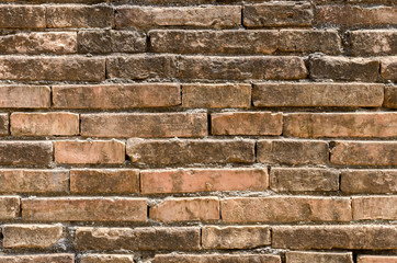 Old grunge brown stone brick wall texture abstract background.