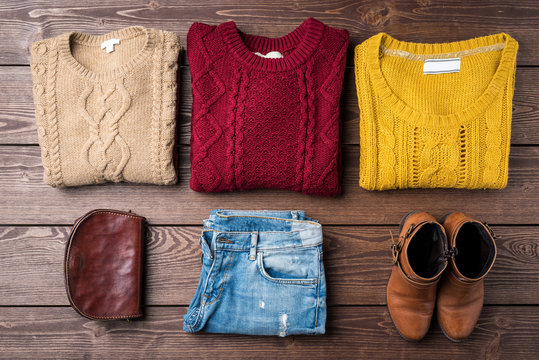 Woman Winter Clothes On Wooden Table