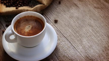 Cup of coffer over wooden surface - Copyspace