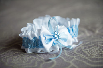 the bride's garter with a blue strip