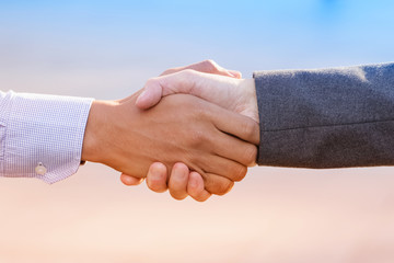 Closeup of business people handshake standing for trusted partne