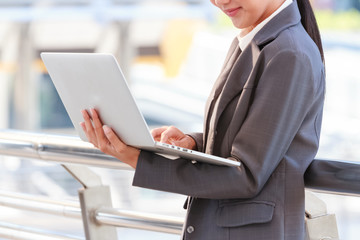 Young business woman in the office with laptop business concept