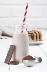 Chocolate milkshake bottle,chocolate bars and cacao.