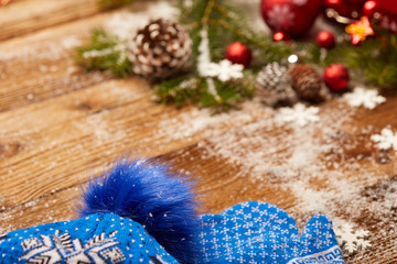 Christmas decorations on a rustic wood background.
