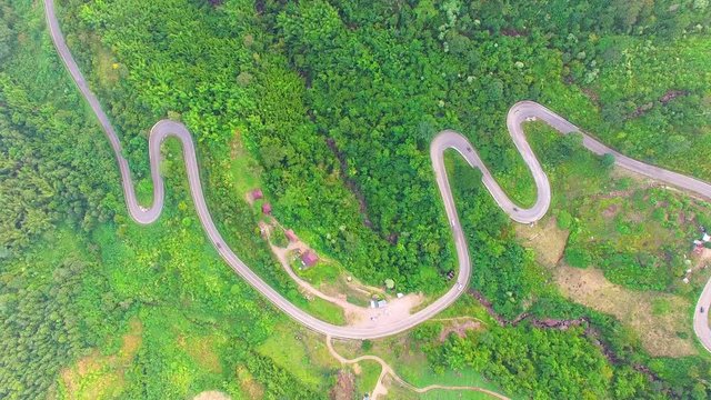 Aerial view of crooked path of road on the mountain