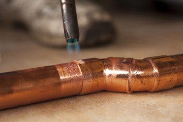 heating copper tubes before soldering - obrazy, fototapety, plakaty