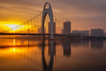 Modern bridge in Zhujiang River and modern building of financial district in guangzhou city, china