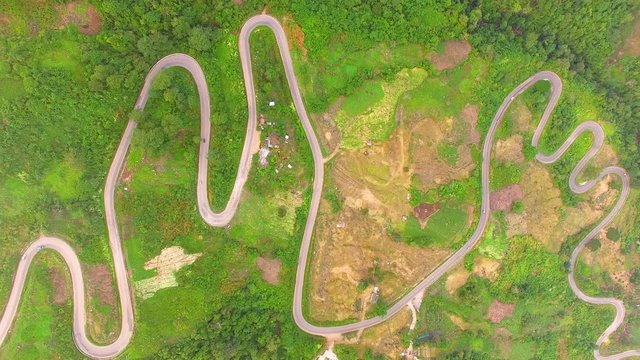 Aerial view of crooked path of road on the mountain