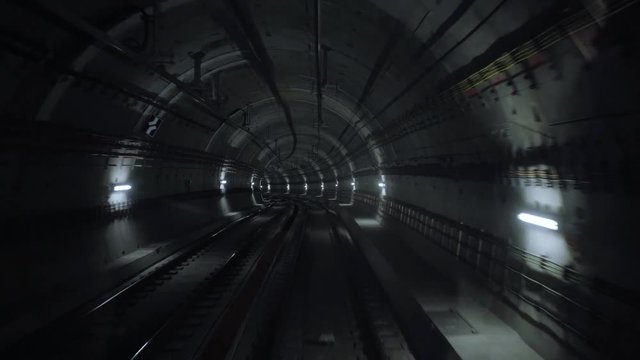 Pov view, subway train starts his moving from one station to other in the end, through curved web of city underground tunnels, meeting another train in the middle of his travel