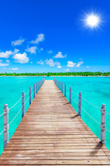 Fototapety  wooden bridge juts out into  of the sea