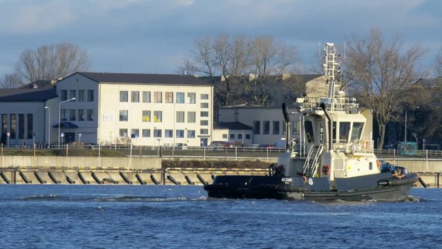VENTSPILS - DECEMBER 16: Close up of tugboat entering port harbor on December 16, 2016 in Ventspils, Latvia. 4K