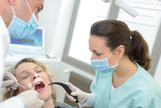dentist curing a female patient