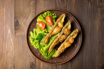Tasty baked fish on plate table close-up