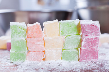 Close up shot turkish delight or lokum of red, green, orange and yellow colors.