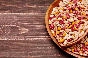 Obraz na płótnie Canvas Haricot beans on wooden table. Healthy food background.