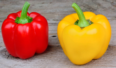 Red and yellow pepper on table