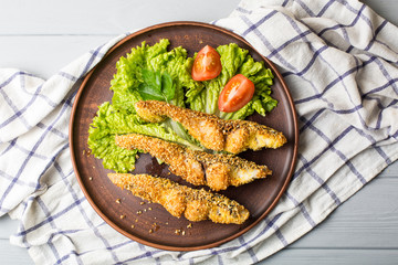 Tasty baked fish on plate table close-up