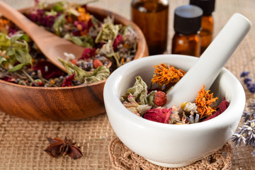 alternative therapy with essential oils and dried herbs