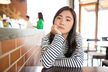 Woman so sad in cafe