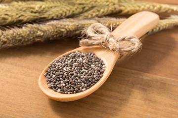 Close-up organics chia seed in a wooden spoon, food for slimming