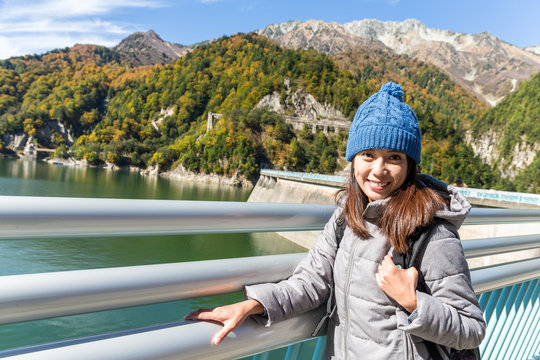 Woman go travel in kurobe dam in Japan