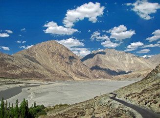 Fototapeta premium Beautiful terrain and lonely road to Nubra valley, Ladakh. 